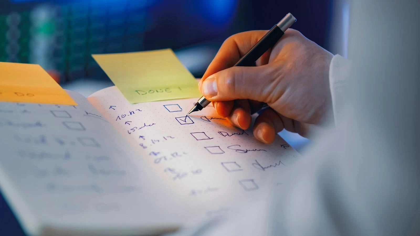Hand writing checklist in notebook