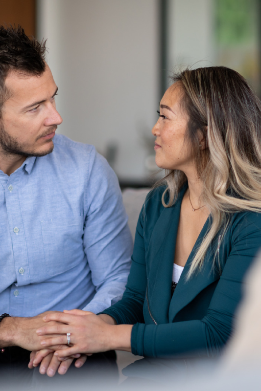 Couple engaged in serious conversation.